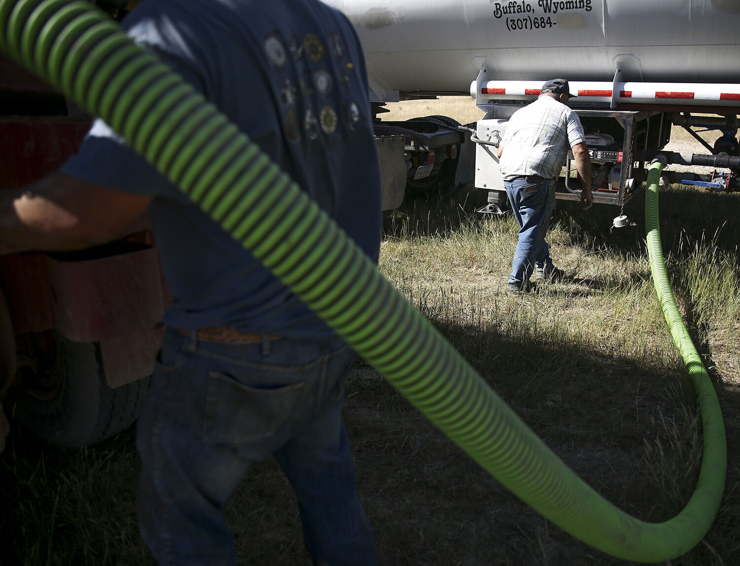Nick Zezas starts the water pump so that he can transfer water from his tanker